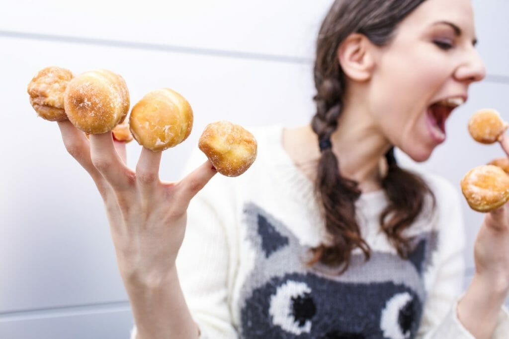 Lady with donuts on each finger. A free image - photo from gratisography. (A collection of free images.)