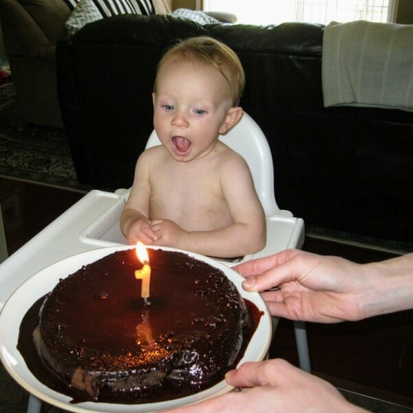 My grandson Levi - on his first birthday. Excited to see the chocolate cake and the glowing candle.