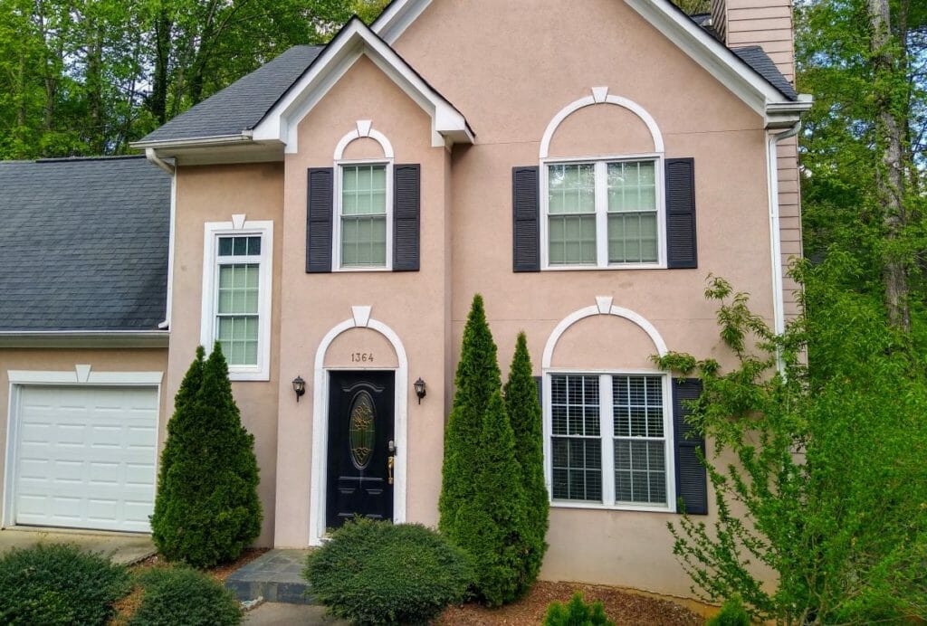 A decorative keystone pattern is repeated above windows and doors on this home in Woodstock, Georgia.