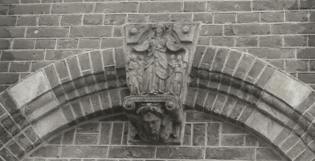 The keystone at the top of this archway depicts Saint Ursula and her followers. 