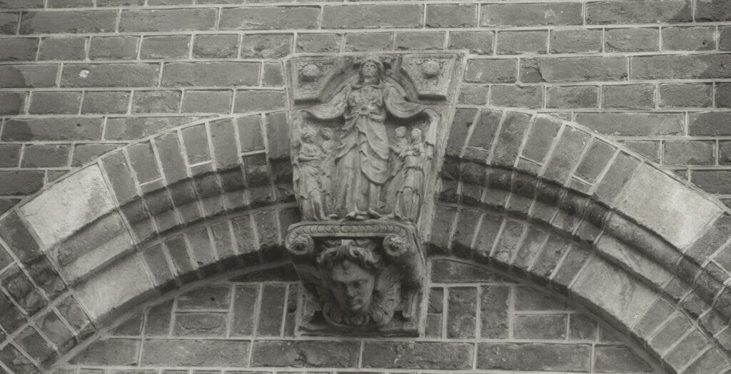 The keystone at the top of this archway depicts Saint Ursula and her followers.