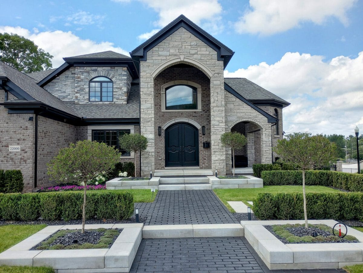 Another beautiful home in Dearborn, Michigan. Near Ford Field city park. The Imagine home features many peaks, arches, and follows the keystone motif in several places.