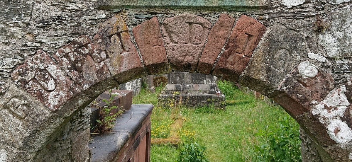The arched entrance to the old Anwoth Kirk (church) in Scotland. Letters carved into the Anwoth Keystone say A.D. for Anno Domini 