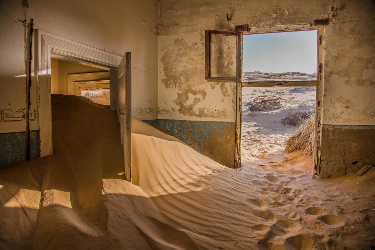 A sand filled house, abandoned for several years, and filled with the shifting sands of time.