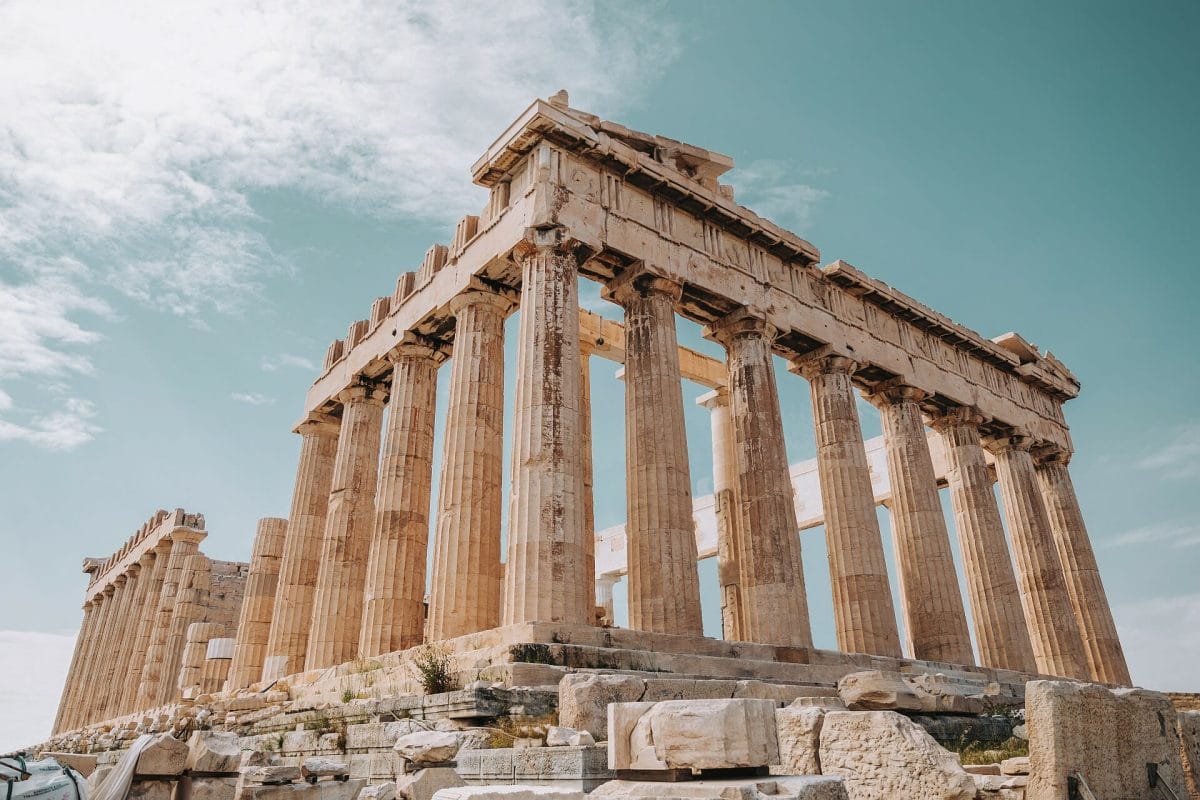Pillars stand tall at the old ruins of the ancient Greek Parthenon.